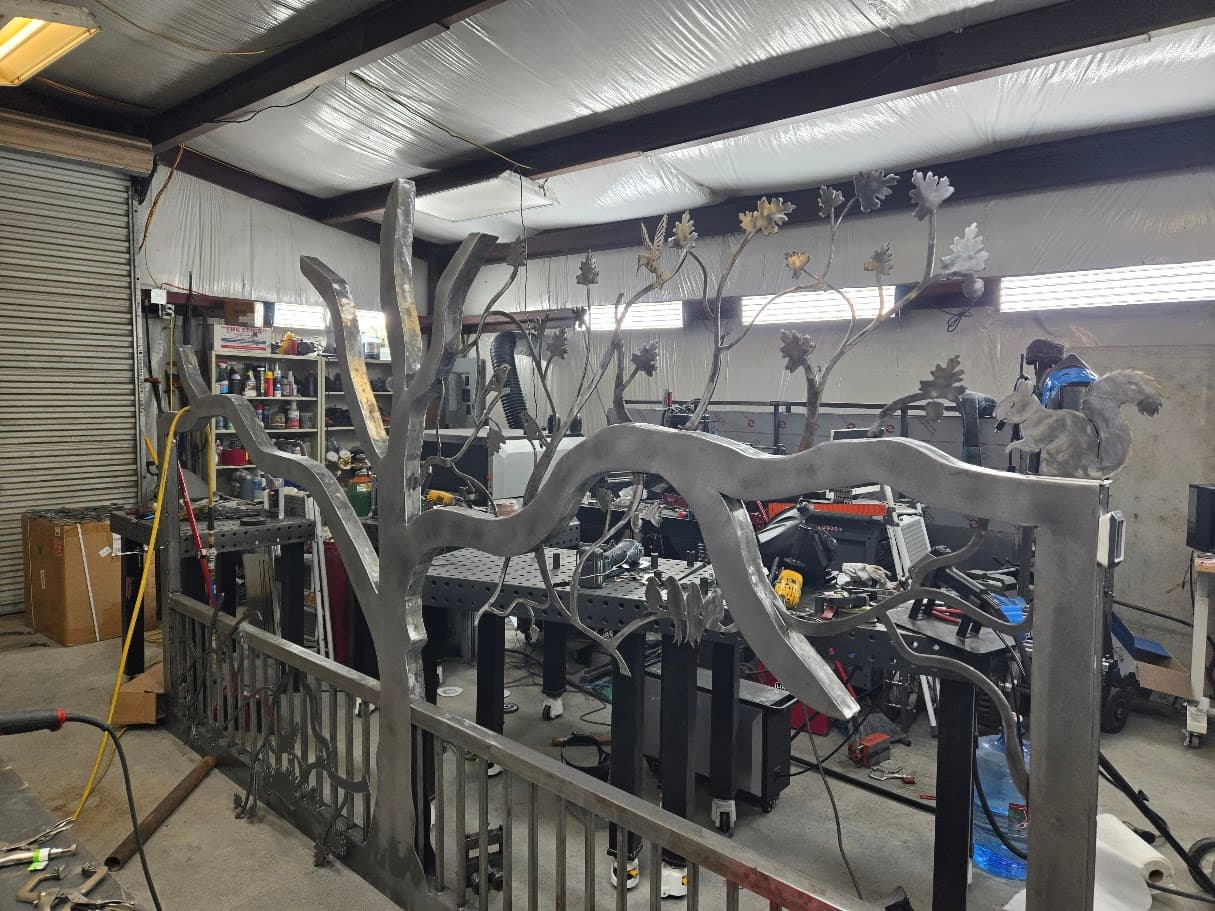 Custom steel tree gate and property feature being fabricated in the CNC Powder shop